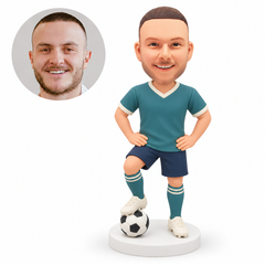 custom bobblehead figure male soccer player with both hands on his hips and one foot resting on a ball