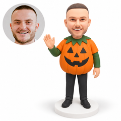 custom bobblehead figure man in a rounded pumpkin costume raising one open palm