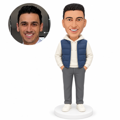 custom bobblehead figure man in a quilted vest over a hoodie with both hands in his trouser pockets MGA-AC1252