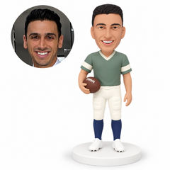 custom bobblehead figure male football player holding a ball at his waist with his other arm down MGA-AC1278