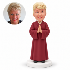 MGA-AC1296 custom bobblehead figure woman in a full length monastic robe praying with both palms together at her chest
