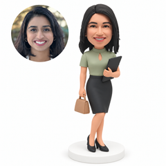 MGA-AC1300 custom bobblehead figure businesswoman in a pencil skirt carrying a folder and handbag with crossed ankles