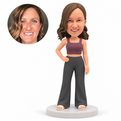 custom bobblehead figure woman in a cropped tank top and flared trousers with one hand on her hip