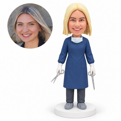 Custom bobblehead figure female surgical worker holding two surgical scissors at her sides