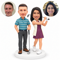 custom bobblehead figures golfing couple with man resting a club at his side and woman finishing a two hand swing