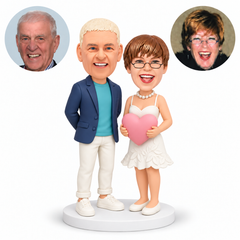 custom bobblehead figures couple with man keeping both hands behind his back and woman in a short dress holding one large heart - MGA-AC1419