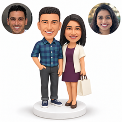 Two custom polymer clay bobblehead figures with matching photo portraits MGA-AC1442