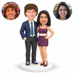custom bobblehead figures couple with a suited man embracing the woman in a short dress as she rests one hand on her hip