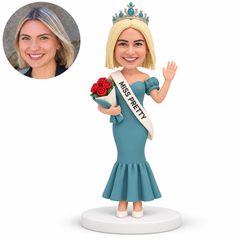 custom bobblehead figure pageant woman in a mermaid gown with a tiara and sash holding roses and waving