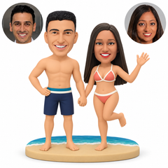 custom bobblehead figures beach couple holding hands with the man resting a hand on his hip and the woman waving with one leg lifted