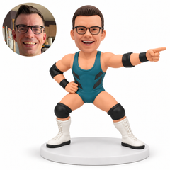 custom bobblehead figure male wrestler in a wide crouch pointing with his left hand and keeping his right hand on his hip with original polymer clay head and matching real photo