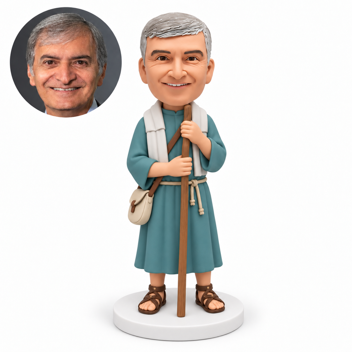 custom bobblehead figure man in an ancient robe and shoulder wrap gripping a staff with both hands beside a hip satchel