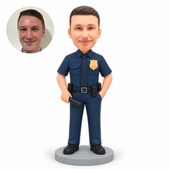 custom bobblehead figure male police officer holding a short black prop baton with his other hand in a pocket