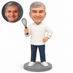 custom bobblehead figure male cook raising a whisk with his other hand resting on his hip