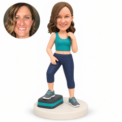 custom bobblehead figure female fitness enthusiast with one foot on a step and an empty hand beside her collar