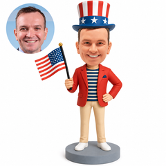 Custom bobblehead figure man in a patriotic red blazer and tall striped hat holding an American flag, with one hand on hip