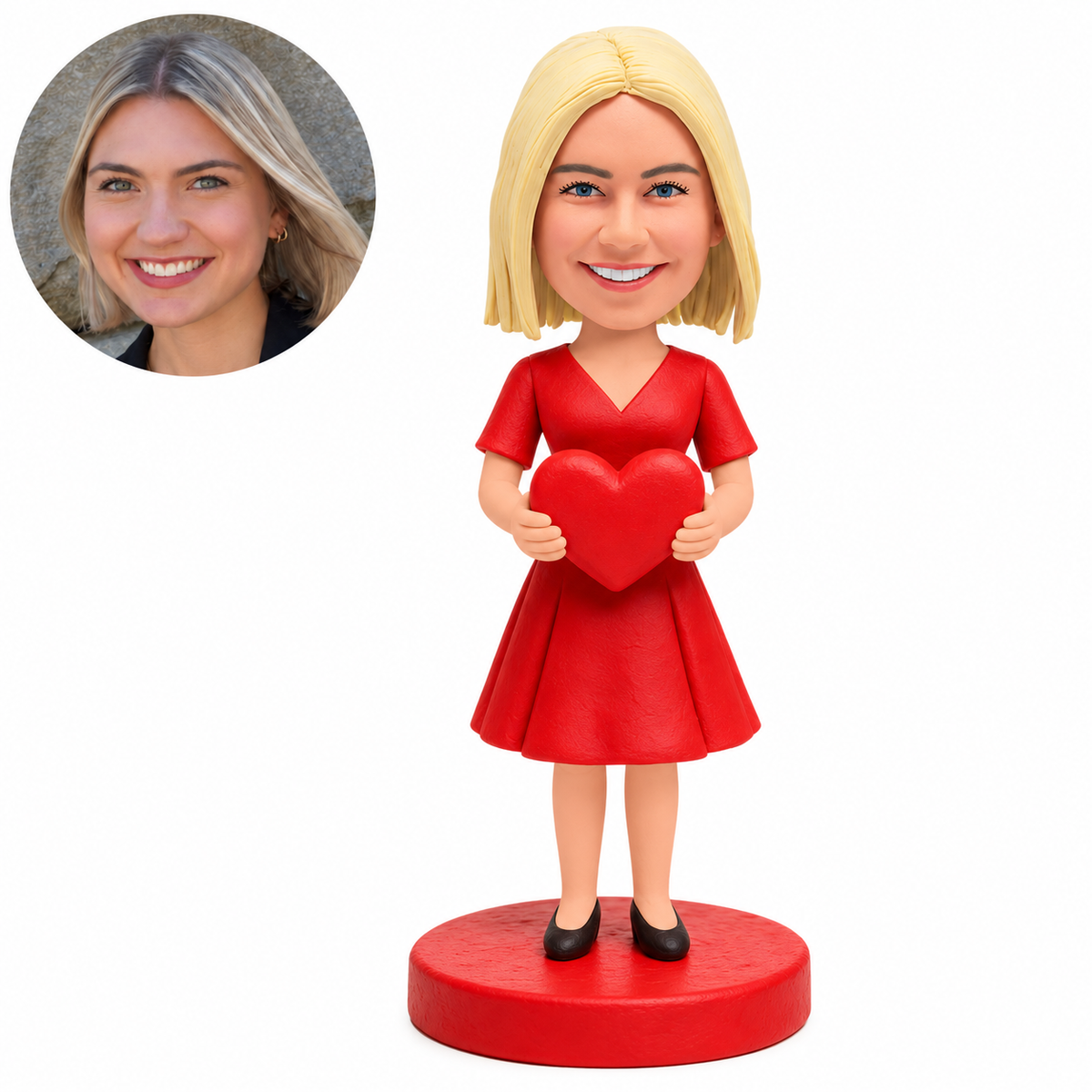 Custom clay bobblehead woman in a red short-sleeved V-neck dress holding a heart, with matching portrait