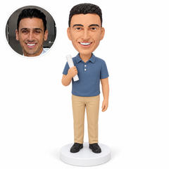 Custom male teacher bobblehead in slate-blue polo holding a rolled lesson paper