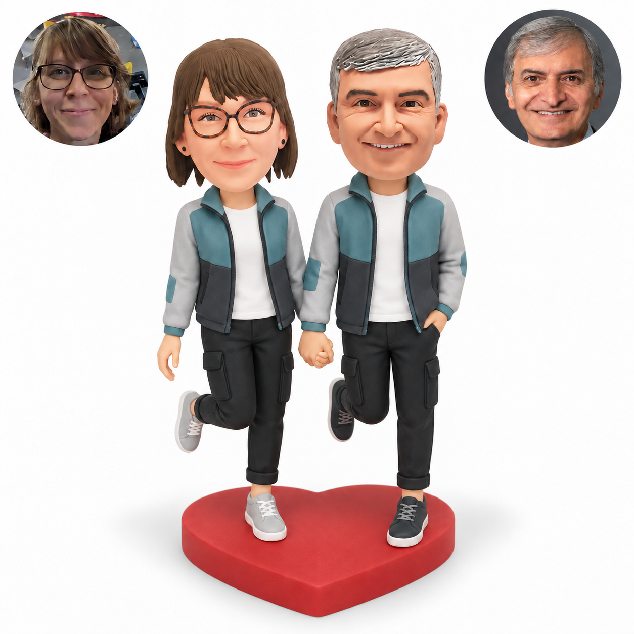 Custom clay bobblehead couple in matching teal jackets holding hands low, both right knees bent backward, with the mans outer hand in a pocket on a red heart base
