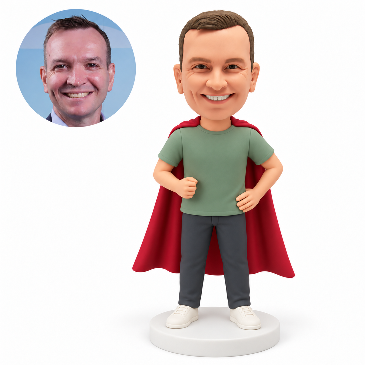 Custom polymer-clay bobblehead man in a sage T-shirt and burgundy cape with his right fist bent near his chest and left hand on his hip, with matching portrait photo