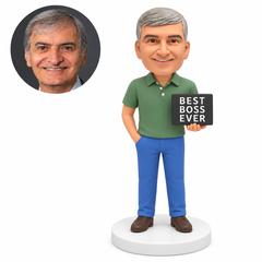 Custom polymer-clay man in a green polo supporting a black Best Boss Ever plaque on his left palm with his right hand in a trouser pocket, standing on a plain round base, with matching real portrait