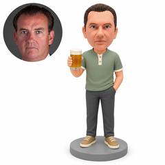 Custom polymer clay man raising a handleless beer glass in his right hand, with his left hand in a trouser pocket, matching circular real portrait and a plain round base.