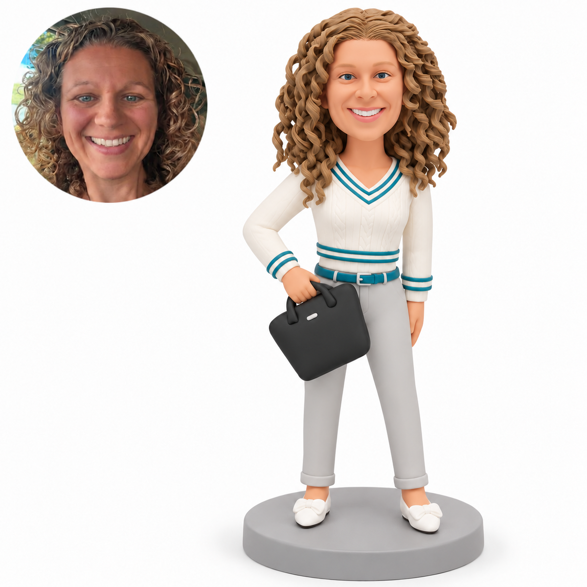 Custom polymer-clay woman with her right forearm bent to grip a tilted black handbag in front of her waist, left arm lowered, ivory and teal top, gray trousers and matching real photo circle.