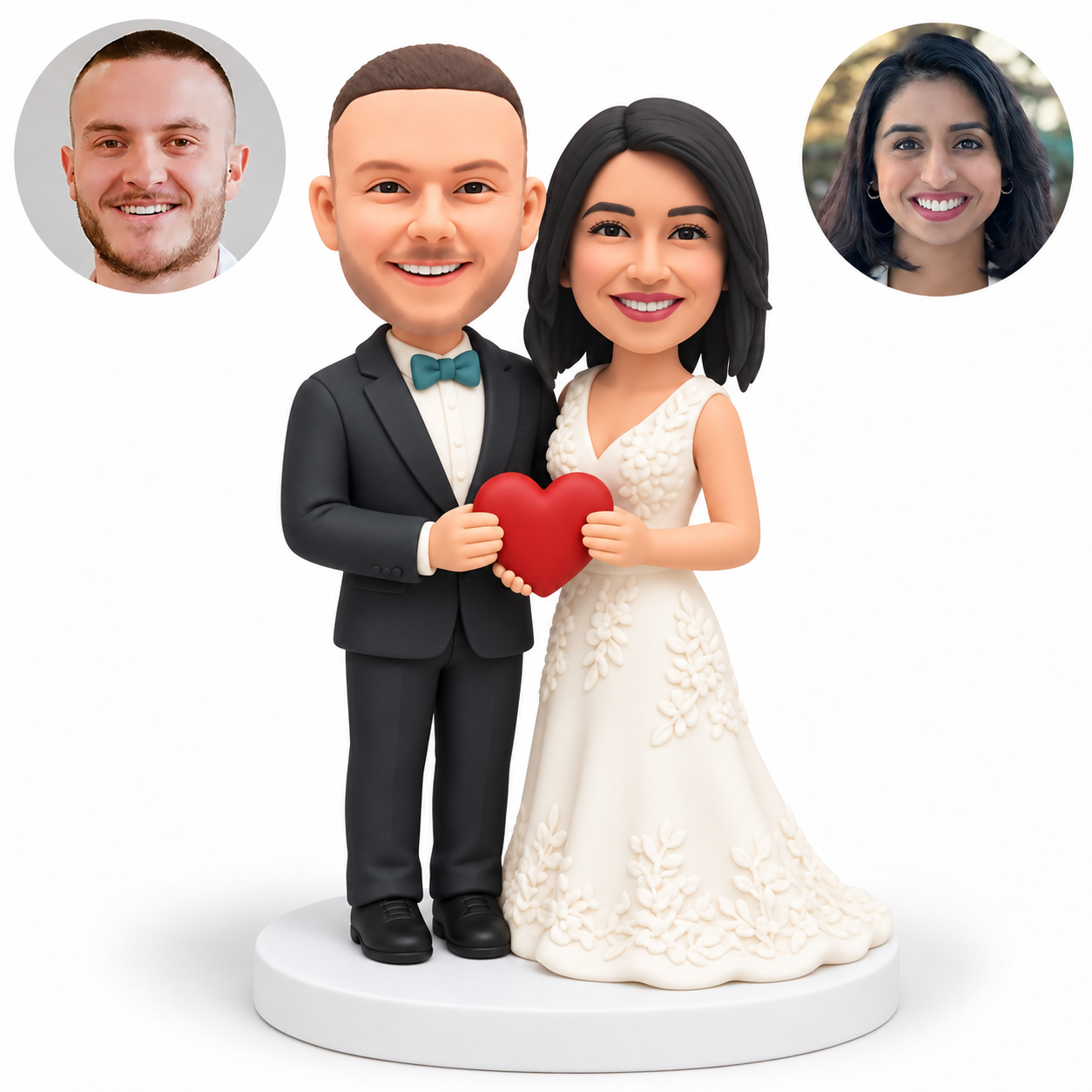 Clay wedding couple holding a small red heart with side grips and a lower supporting hand, a full bridal gown and round white base, with paired real portraits.