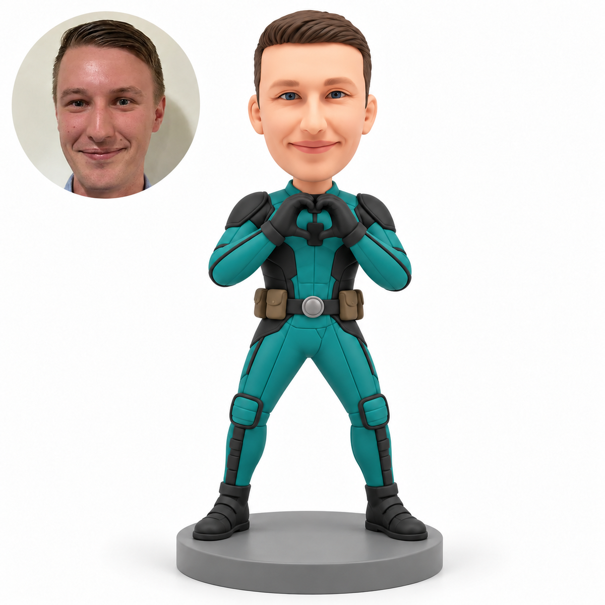 Clay man in a teal hero suit, curved gloved hands joined at his upper chest, two brown hip pouches and planted boots on a gray base, with matching real portrait.