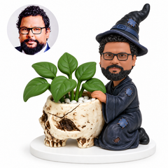 custom bobblehead figure wizard kneeling beside a skull shaped decorative planter