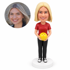 custom bobblehead figure female bowler holding a bowling ball with both hands