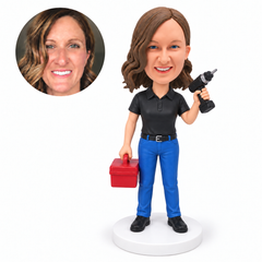 custom bobblehead figure female repair worker holding a cordless drill and toolbox