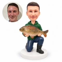custom bobblehead figure fisherman kneeling on one knee and holding a large fish