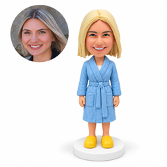 custom bobblehead figure woman in a tied bathrobe with both arms at her sides