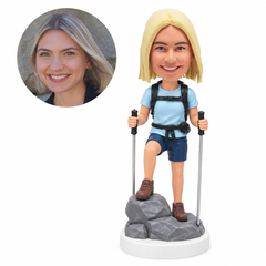 custom bobblehead figure female hiker stepping onto rocks with two trekking poles