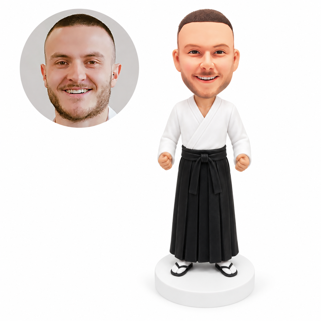custom bobblehead figure male aikido practitioner in a white jacket and black hakama with lowered fists
