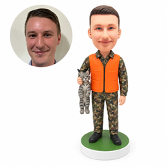 custom bobblehead figure outdoorsman in an orange vest holding a lynx decoration