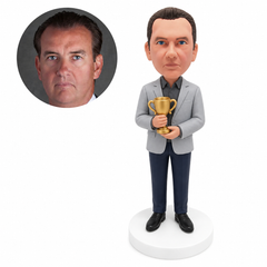 custom bobblehead figure man in a blazer holding a trophy with both hands