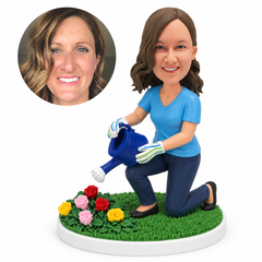 custom bobblehead figure woman kneeling to water flowers with a watering can