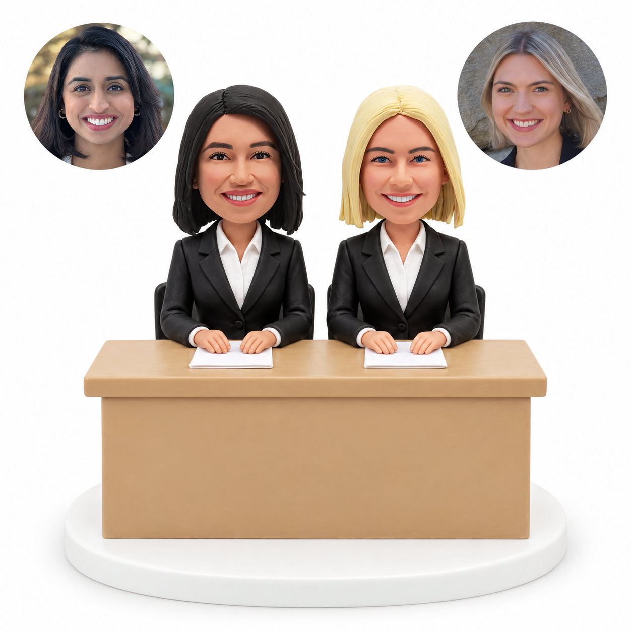 custom bobblehead figures two female news presenters seated behind a desk