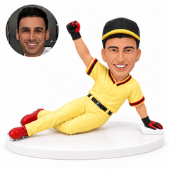 custom bobblehead figure male baseball runner sliding with one hand on the ground and the other fist raised