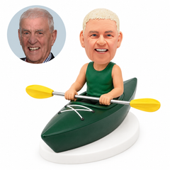 custom bobblehead figure man in a sleeveless top seated in a kayak holding a double-bladed paddle in front