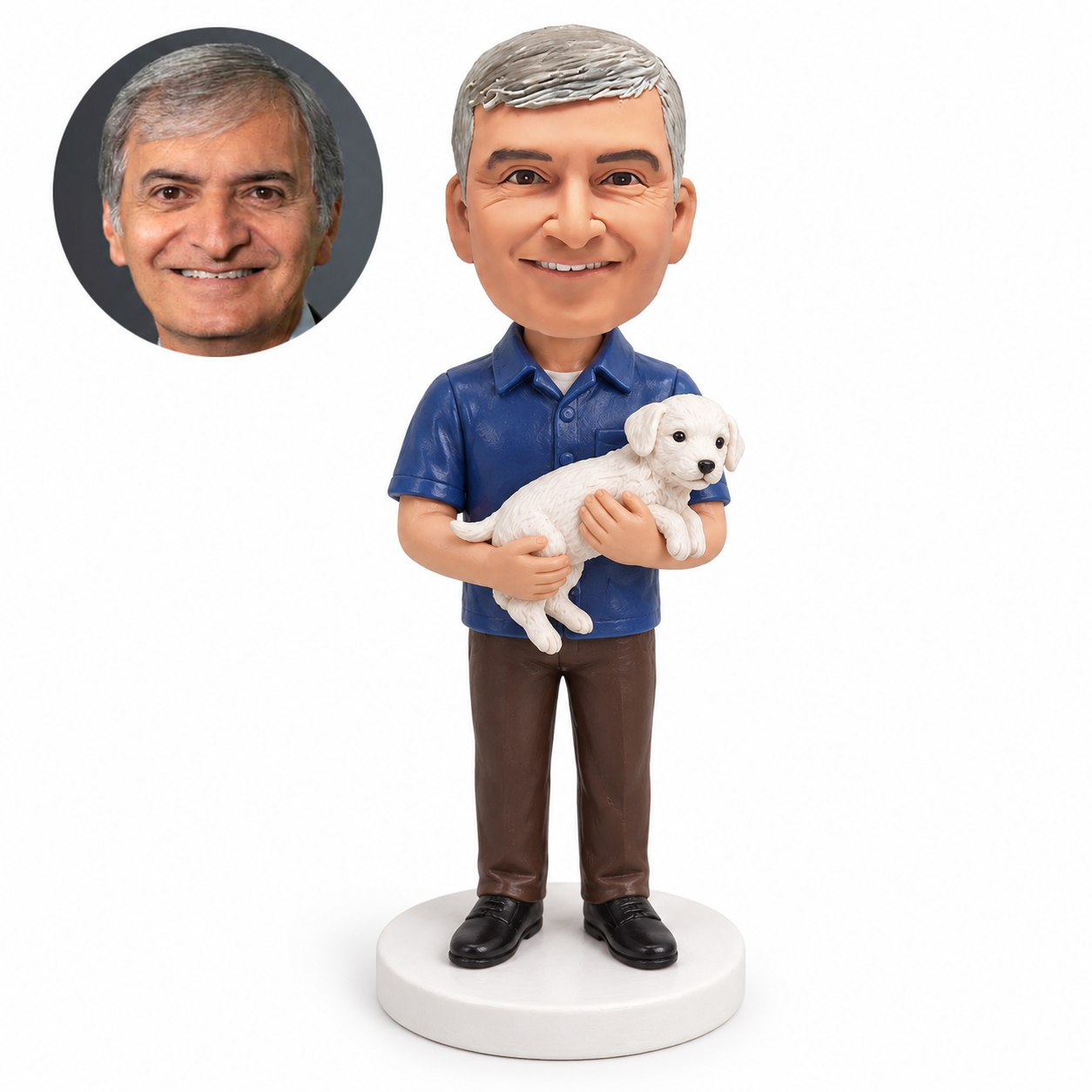 custom bobblehead figure man in a short-sleeved shirt cradling a small white dog