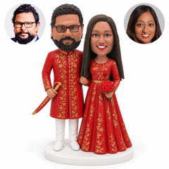 custom bobblehead figures Indian wedding couple in long red garments with a ceremonial sword
