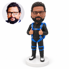custom bobblehead figure male skydiver with a blue harness and parachute pack