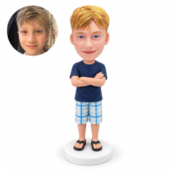 custom bobblehead figure boy in a T-shirt and plaid shorts with his arms crossed