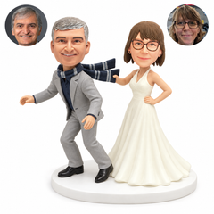 custom bobblehead figures funny wedding couple with the bride pulling the groom by his scarf