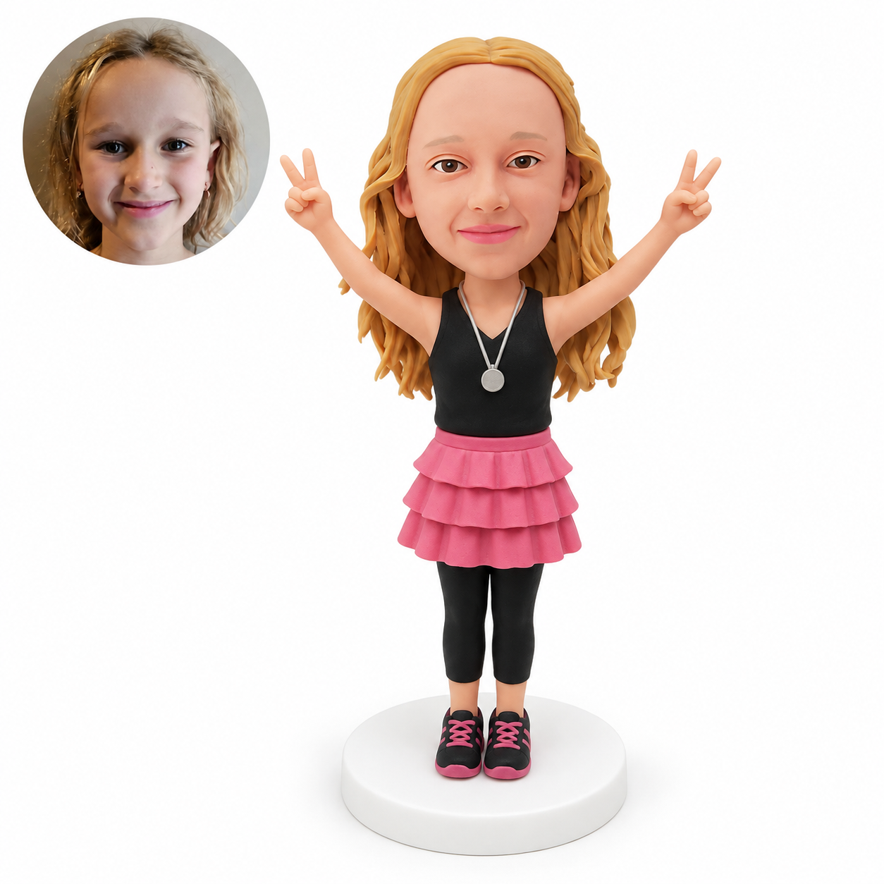 custom bobblehead figure girl in a ruffled skirt and leggings with both arms raised