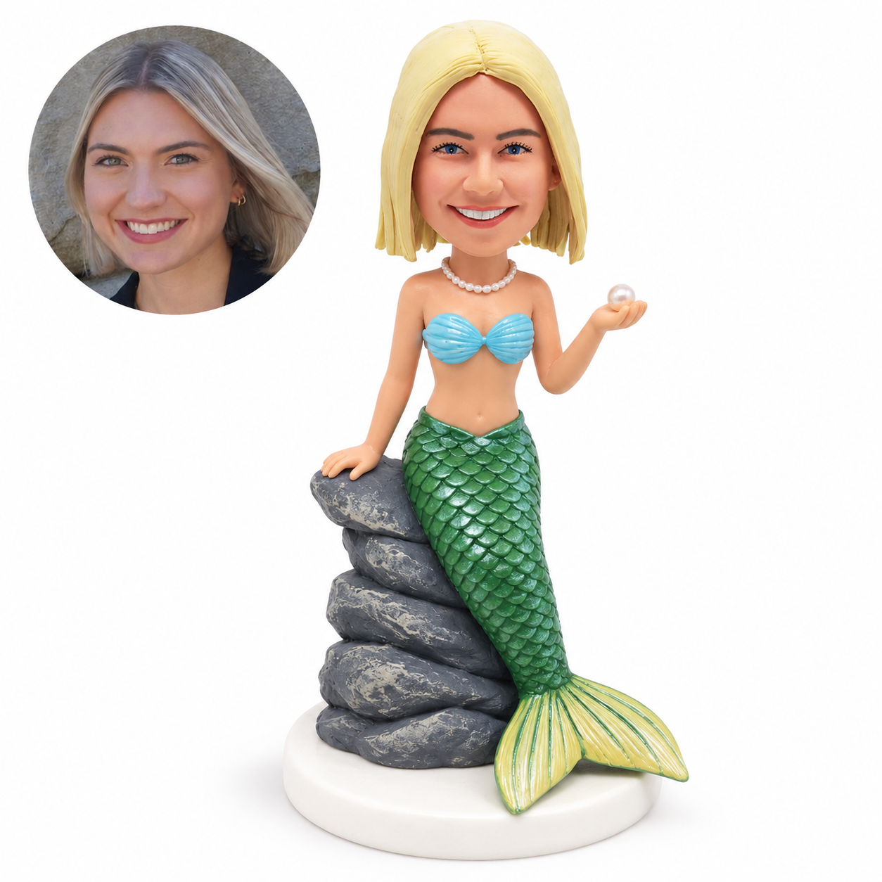 custom bobblehead figure mermaid with a green tail leaning on a rock