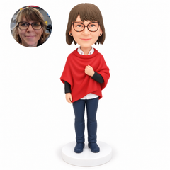 custom bobblehead figure woman in a poncho over a layered top and full trousers